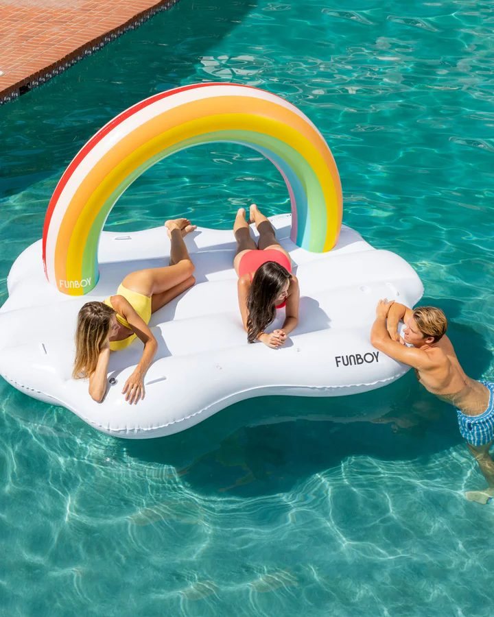Children on a rainbow float